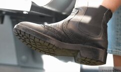 Standing next to her dirty rocking boot and smelling the leather