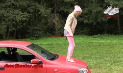 A girl walks barefoot on an Opel car (0013 part2)