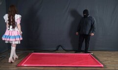 Tickle doll in a pink latex bed