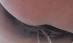 Long piss over the edge of the bathtub