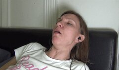 Coughing and searching in the smartphone with headphones (F)
