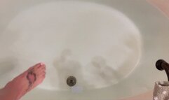 Carissa wearing the sparkly sheer bodysuit in the bathtub and wielding her glass dildo!