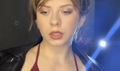 smoking white cigarette in leather jacket