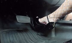 Shiny black stripper heels and fishnets pounding the pedal