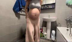 who is spying on a pregnant woman in the toilet?