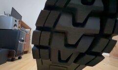 Huge army boots crush a plush toy