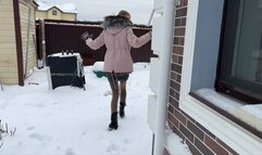 girl in high-heeled boots gets stuck in the snow and falls many times