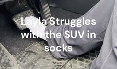 Layla Struggles with the SUV in bare socked feet