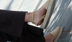 Foot fetish woman moving her sandals, candid shoe fetish