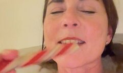 Candy cane in the bathtub; an oral fetish display!