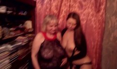 Two lesbians, young and mature in living room