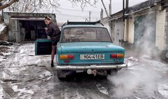 Nastya warms up an old car