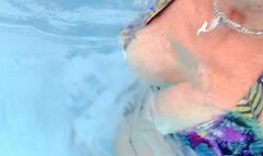 Tiny black flowered bikini in the Resort Pool extended version