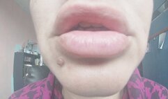 Two red lipsticks and kiss