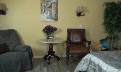 Mistress Amity comes back home and sits on the chair to have her attending female slave remove her heels and worship on her stockings feet