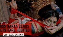 Miss Santa Claus gets tape hogtied