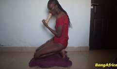 Giving a big white dildo a blowjob