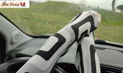 Lady S driving bored in boots and pantyhose