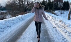 girl walked up the icy mountain in high heels, her heel slipped and she injured her leg