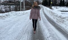 girl in high-heeled sandals always slips on an icy mountain and falls