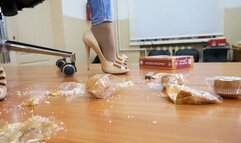 Rocking hottie crushes a pile of food on the table with her beautiful legs in high heel pums