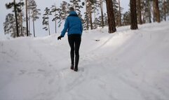 Long sexy legs in high heels walking in the snow and falling through it - Pretty girl storming up a snowy hill