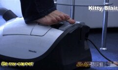 Kitty Blair livingroom cleaning with vacuum on full power