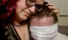 Miss M ready to punish a man tied to a chair wearing adult school uniform