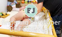 Fingering her diaper before nap