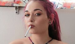 Smoking in a small bikini top,