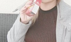 Smoking in a sexy dress, pantyhose and a coat