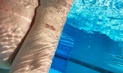 Topless Mermaid in the pool at the Resort