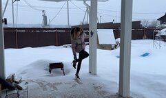 girl in high heels is glued to a cardboard box and can’t get it off her shoes, she’s annoyed by it