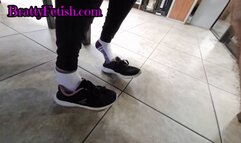 Short candid shoeplay in socks with Latina