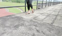 Angelina hanging and hitting her flip flops