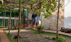 Kahina and Kalinda crush grapes with their brown boots
