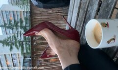 Louboutins on the balcony with large nails and arched soles