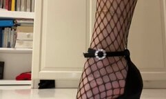 Sensual female feet with Fishnet stockings stiletto heels