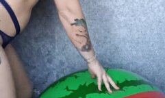 nacked girl jumping on watermelon beachball