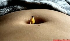 Guy digging into her navel
