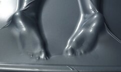 Tickling and flogging feet in a gray latex bed
