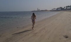 running and stretching on the beach