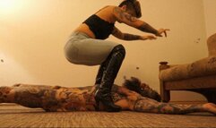 BRUTAL STOMACH SITTING PUNISHMENT WEARING ROUGH JEANS AND DOMINATRIX BOOTS