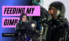 Femdom Rubber Goddess feeds her Gimp