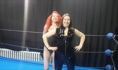 Two Russian dominas tie up a skinny guy in the ring