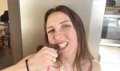 Amazon eats a piece of meat