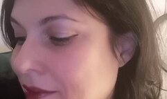 Smoking a white filter cigarette in close up