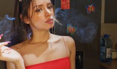 Teasing you while blowing smoke into your face, since you cant have a ciggie of your own ;) Muaa xx