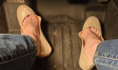 Fifi pedal pumping in sedan wearing shiny nude ballet flats and blue jeans