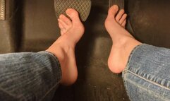Fifi pumping the pedal using both bare feet wearing blue jeans